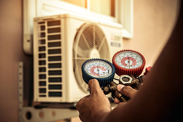 Professional Heat Pump Repair technician working in Rainier, OR